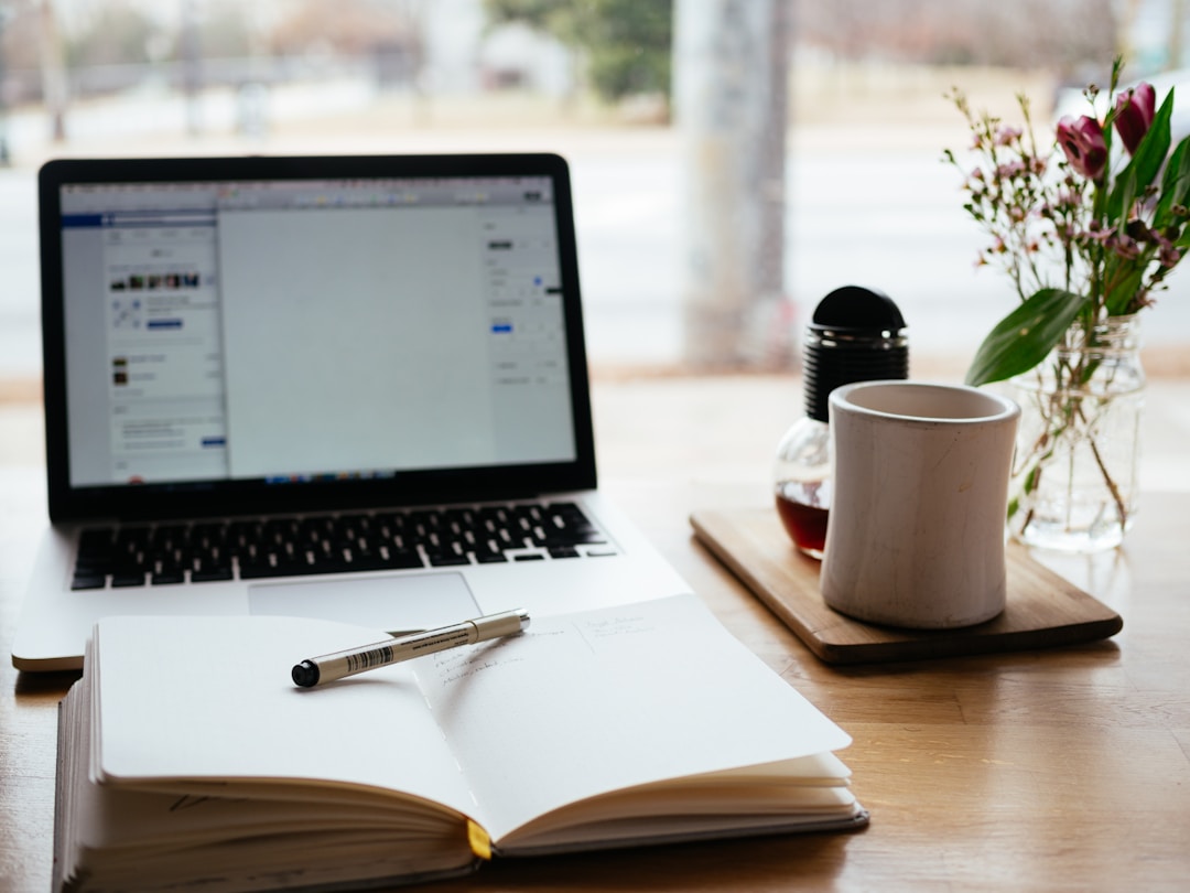 A notebook beside a laptop symbolizing customized value propositions.